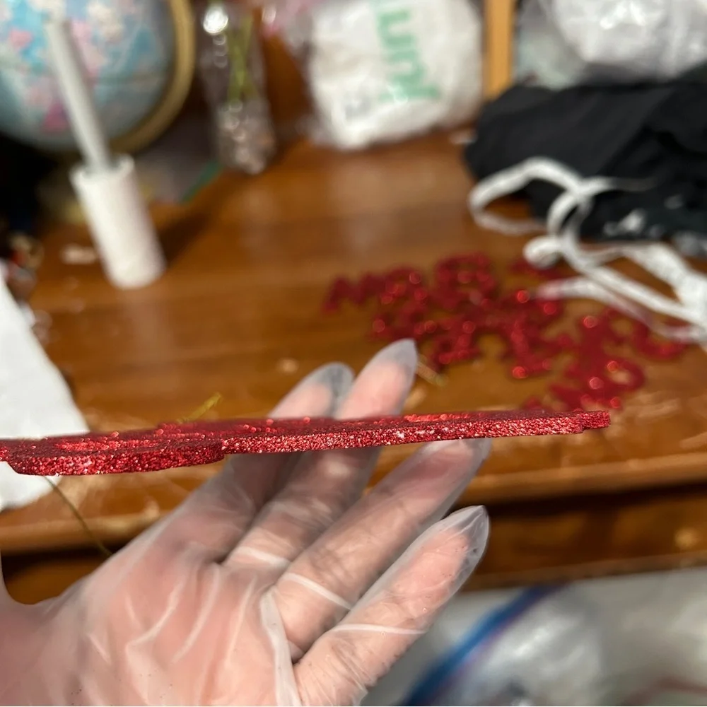 Red Glittery Cursive “Joy” Christmas Ornament - “Dressing”